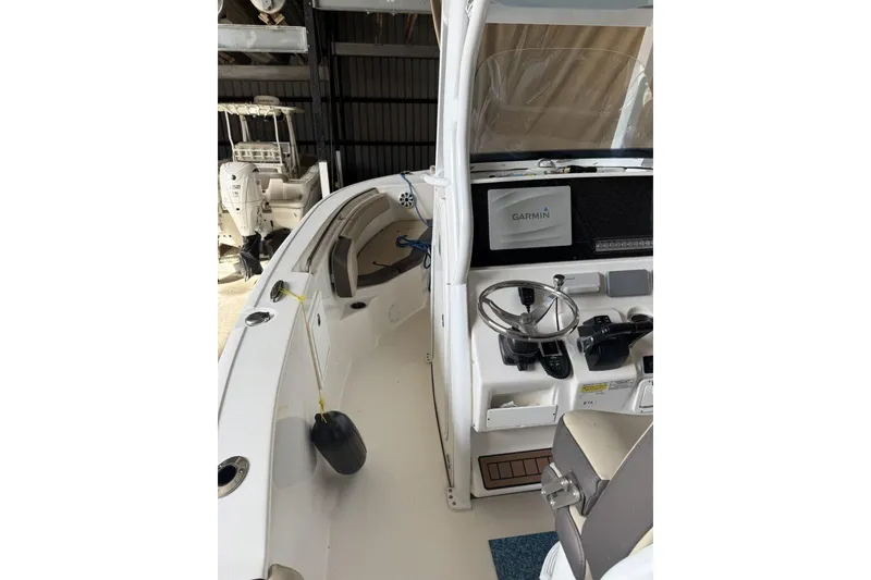 Slide: The Image of 2018 Tidewater 252 CC Adventure boat interior with Garmin navigation system. - 6