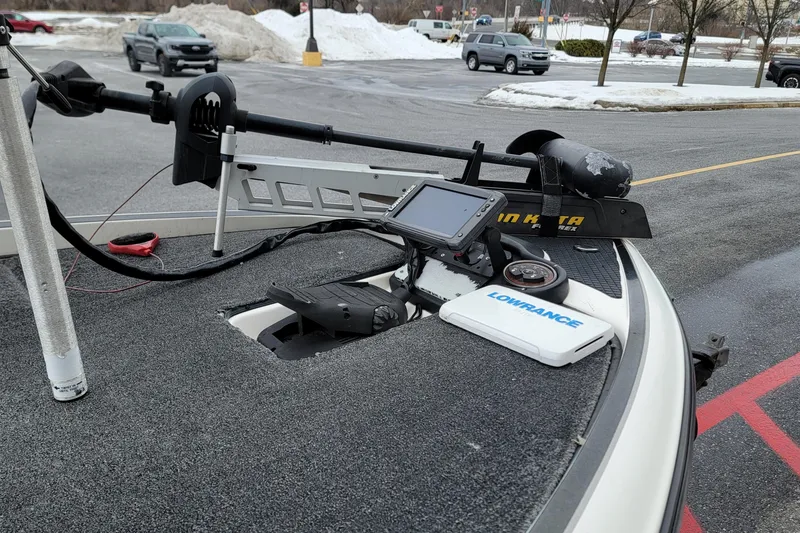 Slide: The Image of 2010 Triton 20XS DC boat with Lowrance electronics and Minn Kota trolling motor in snowy parking lot. - 10