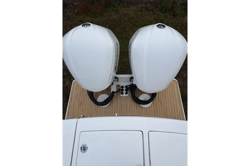Slide: The Image of 2021 Regulator 28 Forward Seating boat with dual outboard engines, top view. - 12