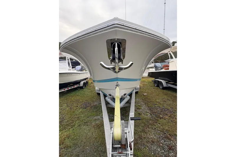 Slide: The Image of 2021 Regulator 28 Forward Seating boat on trailer, front view. - 13