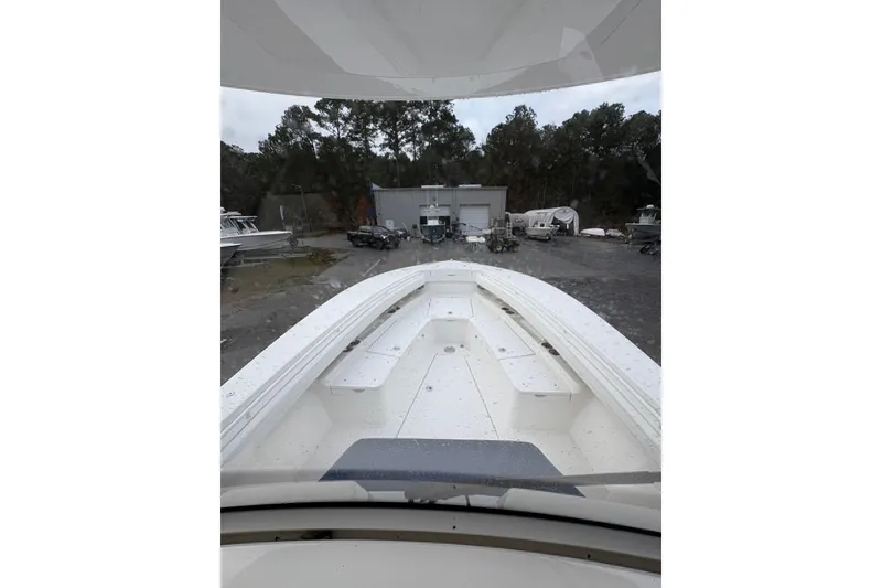 Slide: The Image of 2021 Regulator 28 Forward Seating boat in storage yard, front view. - 3