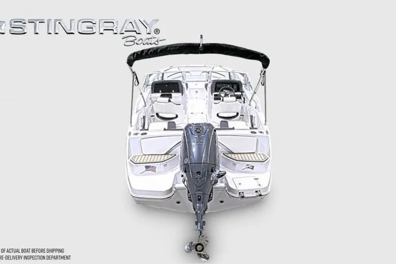 Slide: The Image of 2026 Stingray 20 SBX boat, rear view with outboard motor and seating. - 3