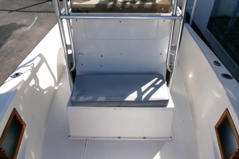 Slide: The Image of 1989 SeaCraft SC 20 Classic boat interior with cushioned seating and stainless steel frame. - 11