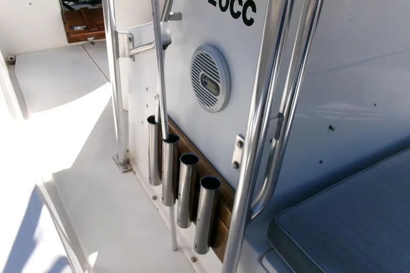 Slide: The Image of 1989 SeaCraft SC 20 Classic boat interior with rod holders and speaker. - 14