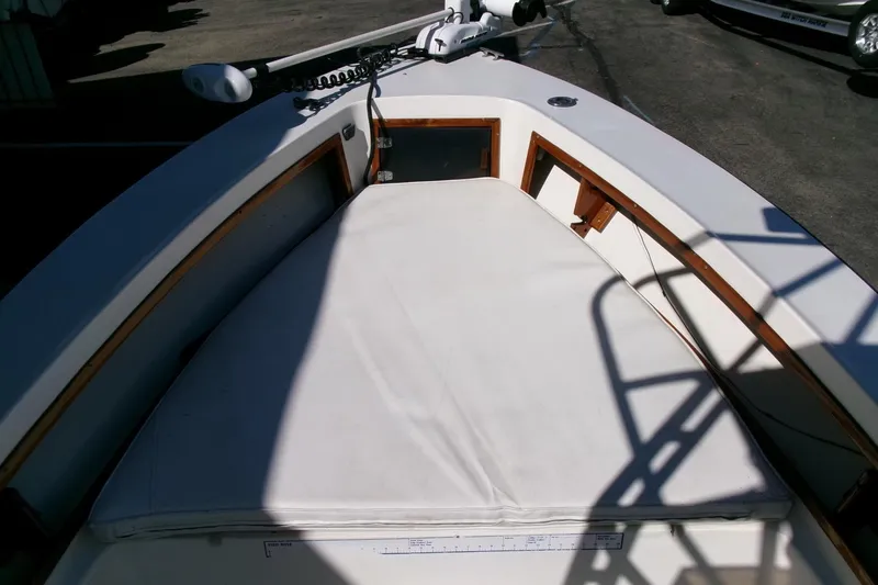 Slide: The Image of 1989 SeaCraft SC 20 Classic boat interior with cushioned seating and wooden trim. - 6