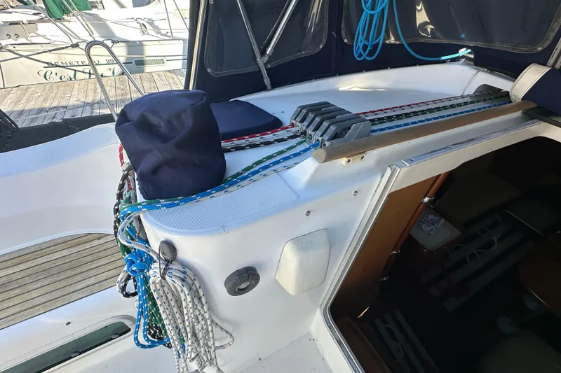 Slide: The Image of Deck of 2001 Beneteau 381 sailboat with ropes and winches, docked at marina. - 15