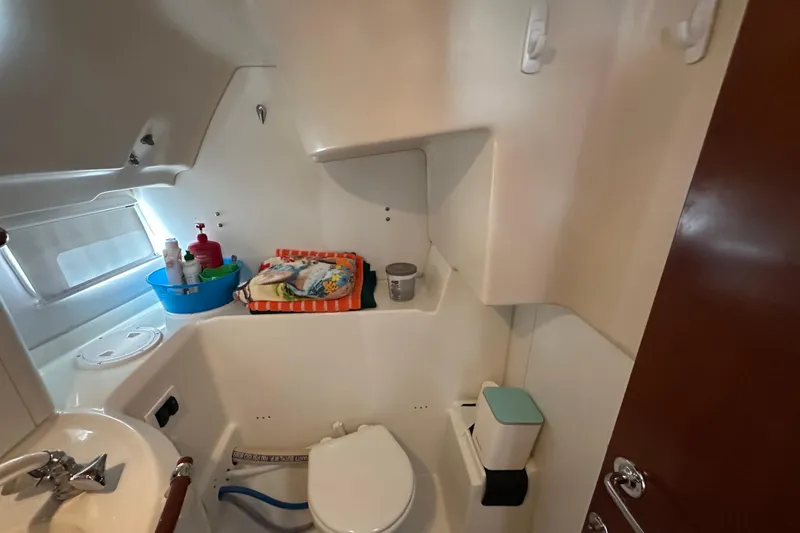 Slide: The Image of Bathroom interior of a 2001 Beneteau 381 sailboat, featuring a compact design. - 33