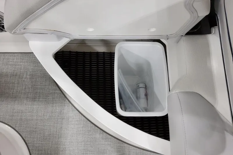 Slide: The Image of 2026 Formula 240 Bowrider interior storage compartment with trash bin. - 11