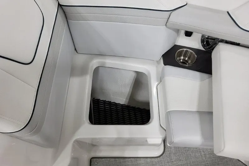 Slide: The Image of 2026 Formula 240 Bowrider interior seating with cup holder and storage compartment. - 16