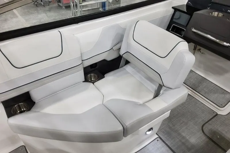 Slide: The Image of 2026 Formula 240 Bowrider interior seating with modern design and cup holders. - 25