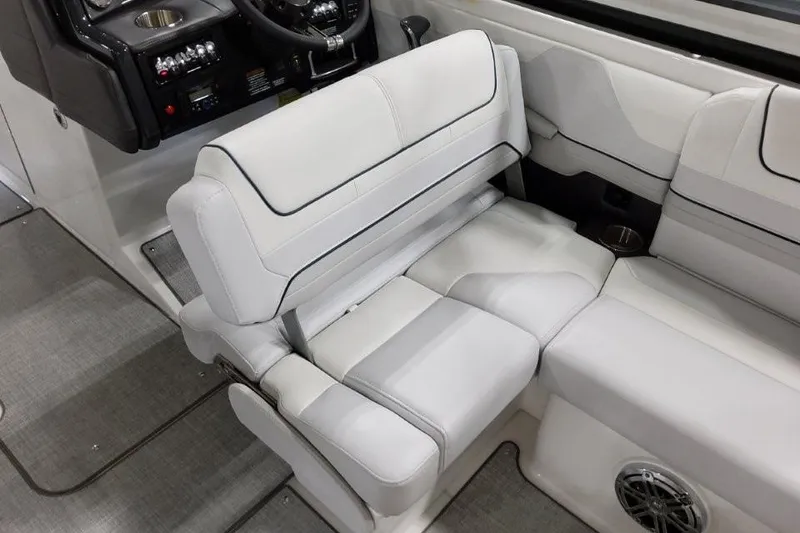 Slide: The Image of 2026 Formula 240 Bowrider interior with luxurious white seating and modern dashboard. - 27