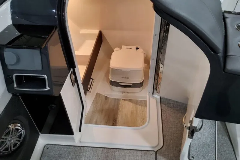 Slide: The Image of 2026 Formula 240 Bowrider interior with compact portable toilet and modern design. - 31