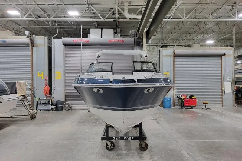 Slide: The Image of 2026 Formula 240 Bowrider boat in a warehouse, front view. - 5