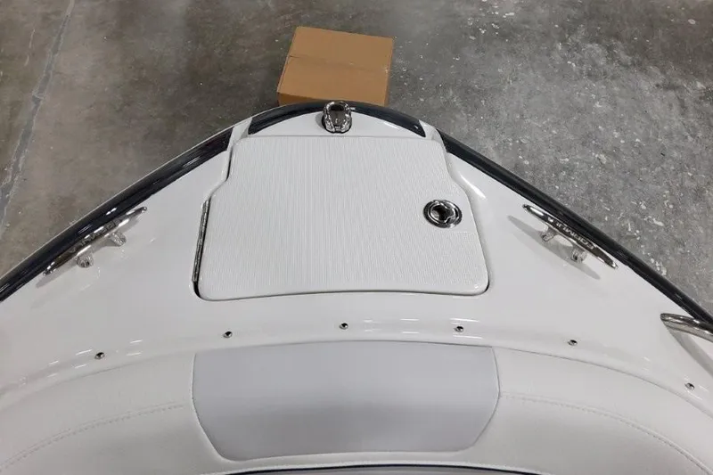 Slide: The Image of 2026 Formula 240 Bowrider boat bow with sleek design and storage compartment. - 8