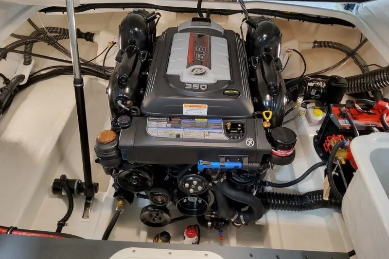 Slide: The Image of Engine compartment of a 2026 Formula 240 Bowrider boat, featuring a powerful 350 engine. - 9