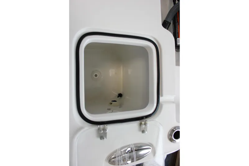 Slide: The Image of 2022 Sea Hunt Gamefish 25 livewell interior, featuring a clean, white compartment. - 15