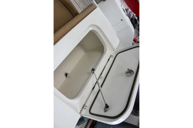 Slide: The Image of 2022 Sea Hunt Gamefish 25 storage compartment with open hatch and hydraulic support. - 17