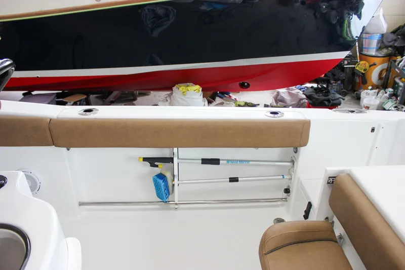 Slide: The Image of 2022 Sea Hunt Gamefish 25 interior with storage and seating, featuring a sleek design. - 21