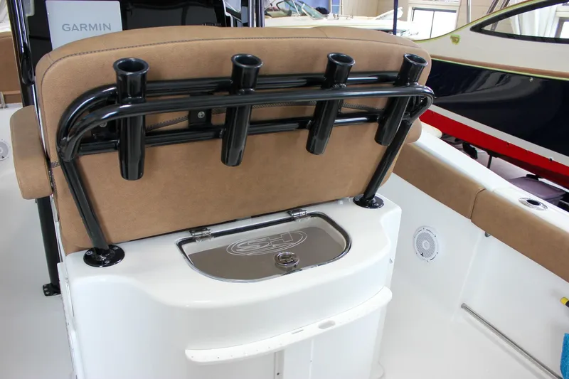 Slide: The Image of 2022 Sea Hunt Gamefish 25 boat interior with rod holders and seating. - 22