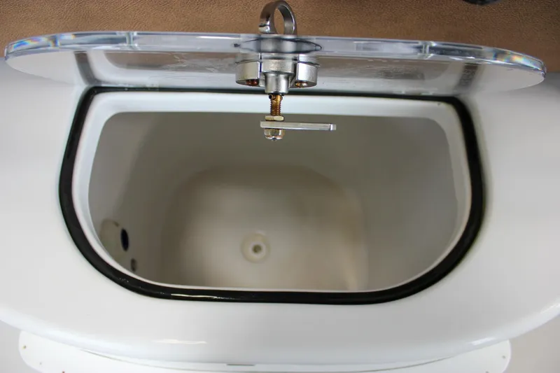 Slide: The Image of 2022 Sea Hunt Gamefish 25 livewell with open lid, showcasing interior design. - 24