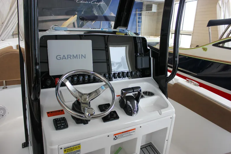 Slide: The Image of 2022 Sea Hunt Gamefish 25 boat console with Garmin navigation system. - 32