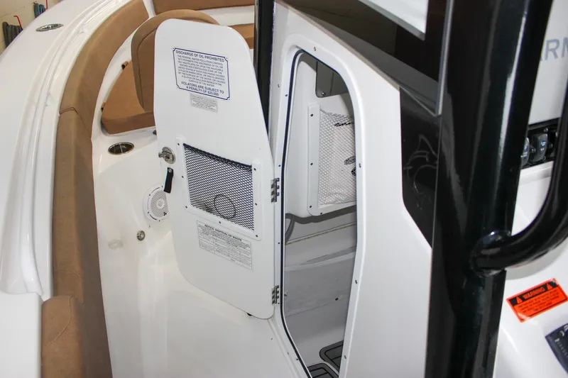 Slide: The Image of 2022 Sea Hunt Gamefish 25 boat interior with open storage compartment. - 39