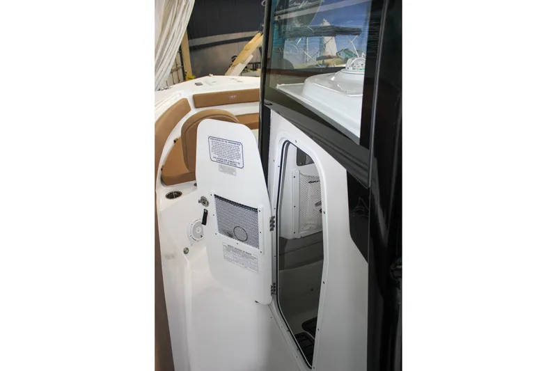Slide: The Image of 2022 Sea Hunt Gamefish 25 boat interior with open storage compartment. - 40