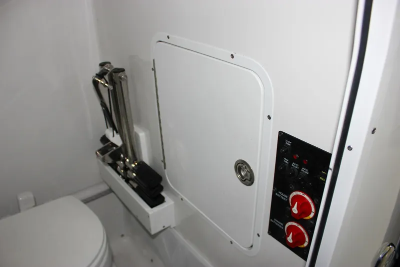 Slide: The Image of 2022 Sea Hunt Gamefish 25 interior with control panel and storage compartment. - 42