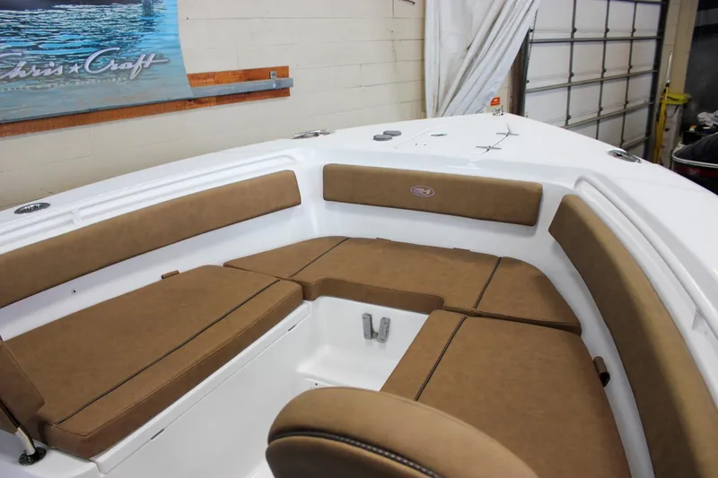 Slide: The Image of 2022 Sea Hunt Gamefish 25 boat interior with tan cushioned seating. - 54