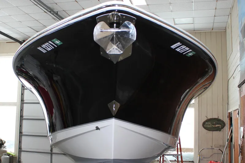 Slide: The Image of 2022 Sea Hunt Gamefish 25 boat in indoor storage, front view. - 62