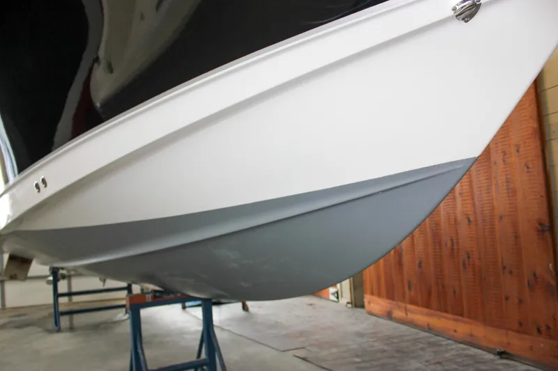 Slide: The Image of 2022 Sea Hunt Gamefish 25 boat hull in a storage facility. - 64