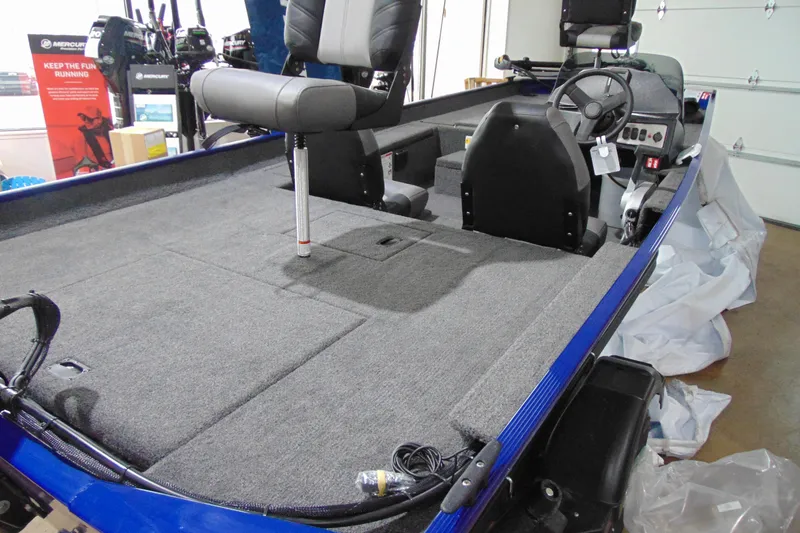 Slide: The Image of 2026 Crestliner 1700 Storm boat interior with seating and steering console. - 12