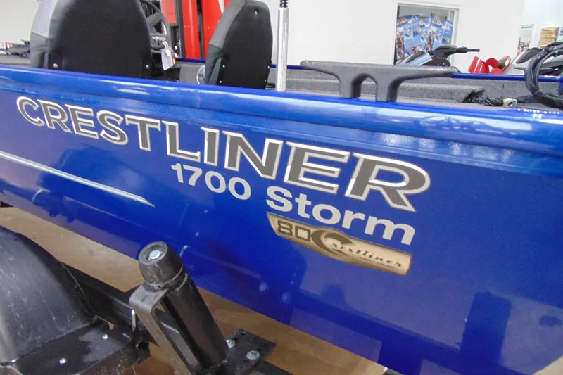 Slide: The Image of Blue 2026 Crestliner 1700 Storm boat with logo and seating visible. - 13