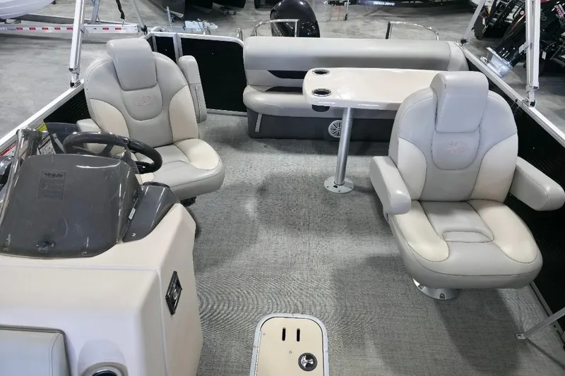 Slide: The Image of 2023 Princecraft Vectra 23 boat interior with plush seating and steering console. - 10