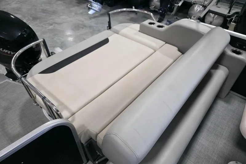 Slide: The Image of 2023 Princecraft Vectra 23 boat interior with beige seating and cup holders. - 12