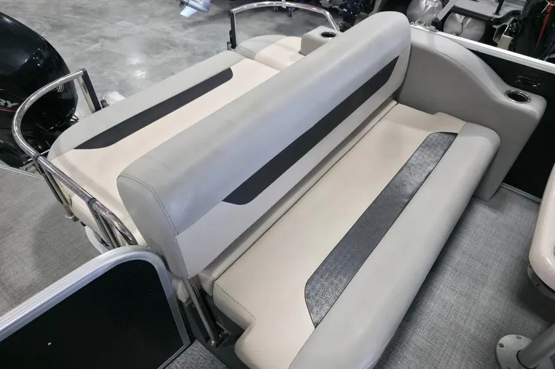Slide: The Image of 2023 Princecraft Vectra 23 boat interior with beige seating and cup holders. - 13