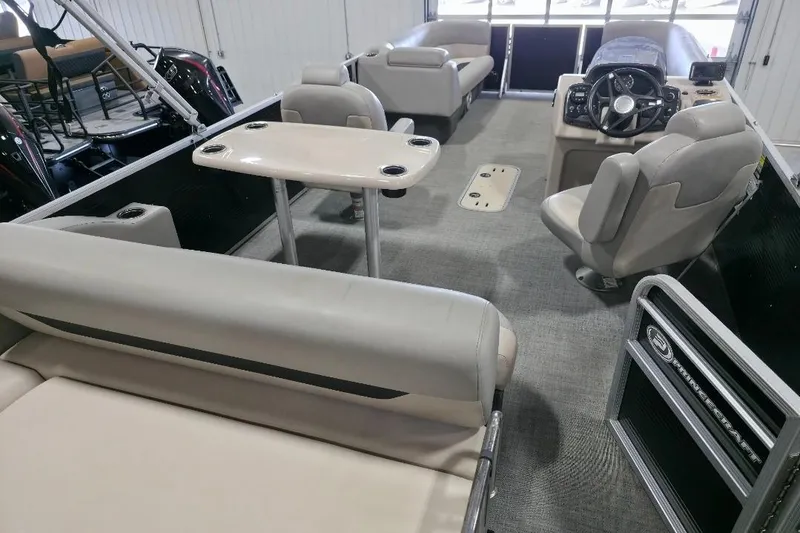 Slide: The Image of 2023 Princecraft Vectra 23 pontoon boat interior with seating and steering console. - 14