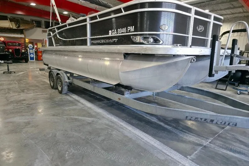 Slide: The Image of 2023 Princecraft Vectra 23 pontoon boat on trailer in a showroom. - 3