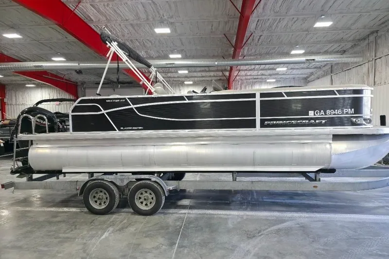 Slide: The Image of 2023 Princecraft Vectra 23 pontoon boat on trailer in indoor storage facility. - 4