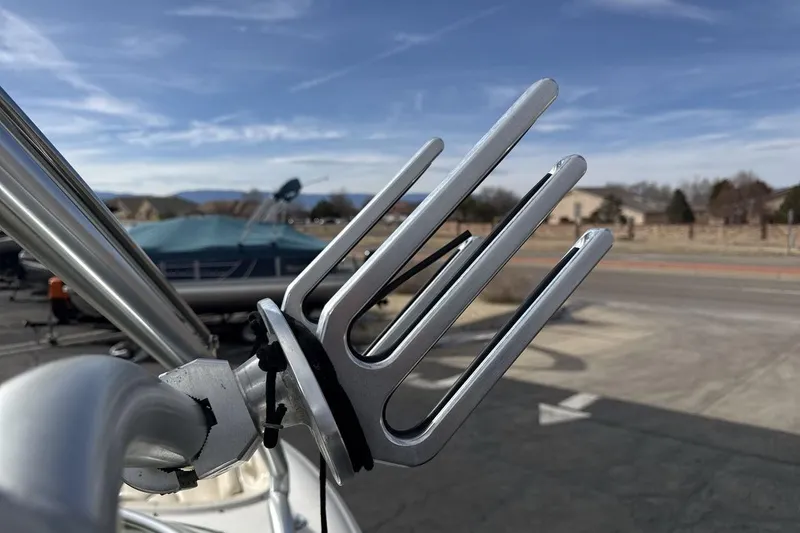 Slide: The Image of Wakeboard rack on a 2004 Sea Ray 220 Select boat, parked outdoors. - 22