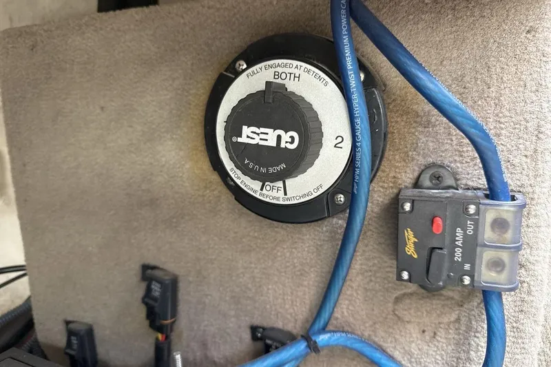 Slide: The Image of Battery switch and wiring in a 2004 Sea Ray 220 Select boat. - 23
