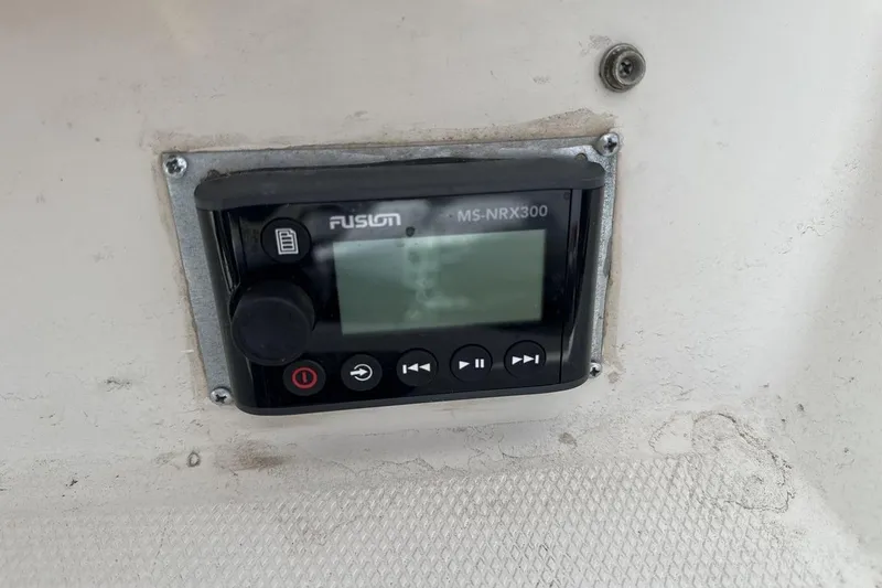 Slide: The Image of Fusion MS-NRX300 stereo system on 2004 Sea Ray 220 Select boat dashboard. - 25