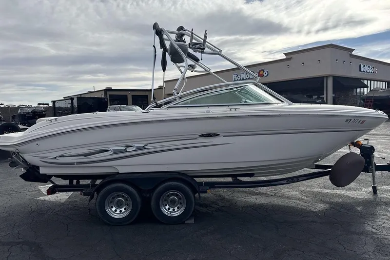 Slide: The Image of 2004 Sea Ray 220 Select boat on trailer, parked outside dealership. - 6
