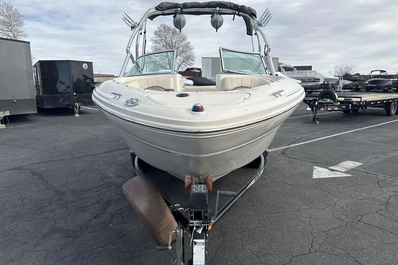 Slide: The Image of 2004 Sea Ray 220 Select boat on trailer in parking lot. - 8