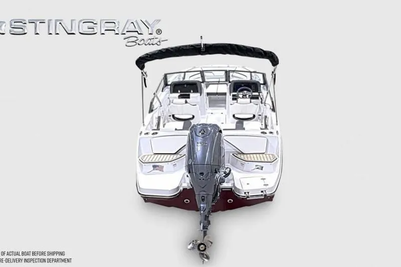 Slide: The Image of 2026 Stingray 20 SBX boat, rear view with outboard motor and seating. - 6