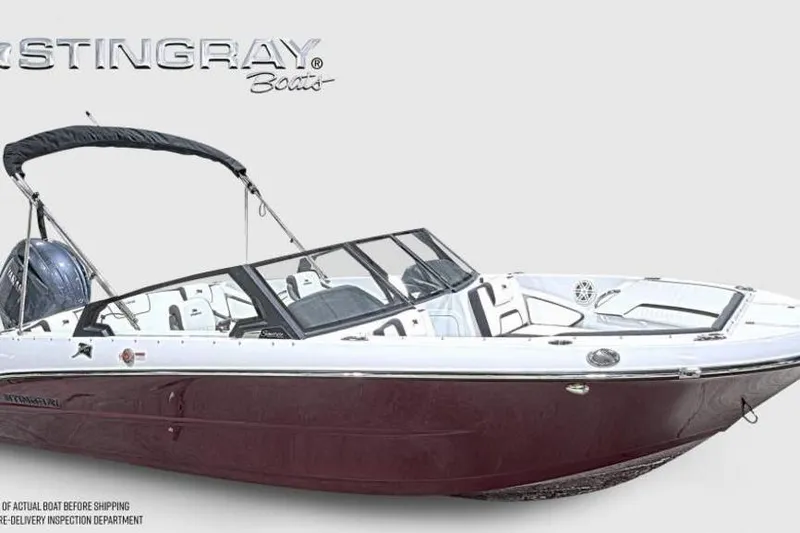 Slide: The Image of 2026 Stingray 20 SBX boat with sleek design and maroon hull. - 1