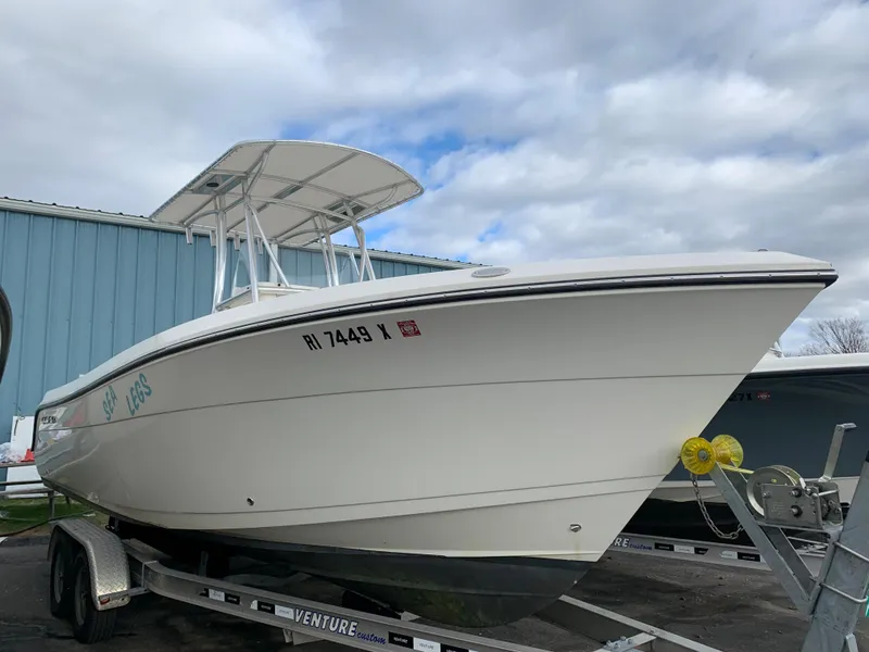 The Image of 2022 Cobia 237 Center Console on trailer, side view. - 0