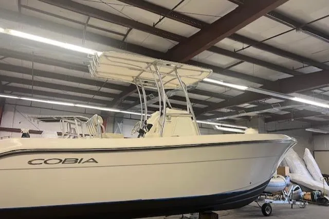 Slide: The Image of 2022 Cobia 237 Center Console boat in warehouse. - 4