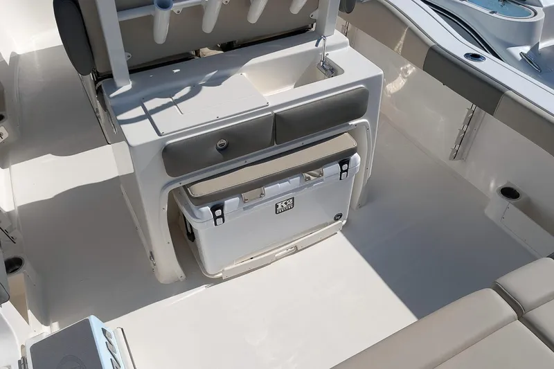 Slide: The Image of 2026 Key West 263 FS boat interior with seating and storage compartments. - 10