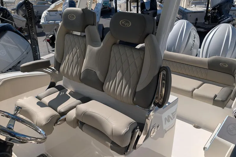 Slide: The Image of 2026 Key West 263 FS boat interior with luxurious seating and modern steering wheel. - 14